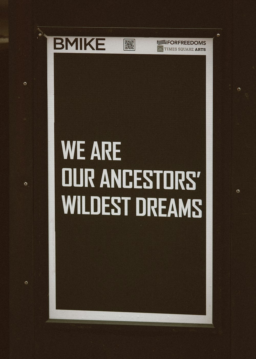 a black and white sign that says we are our ancestor's wildest dreams