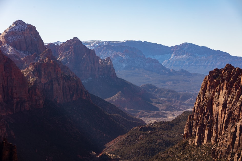 Brown and green Utah mountains under blue sky, elk hunting terrain comparison