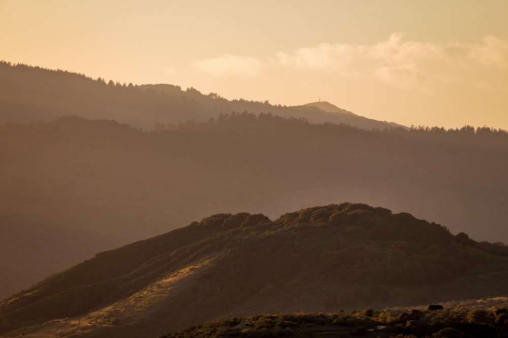 brown mountain under white sky during daytime