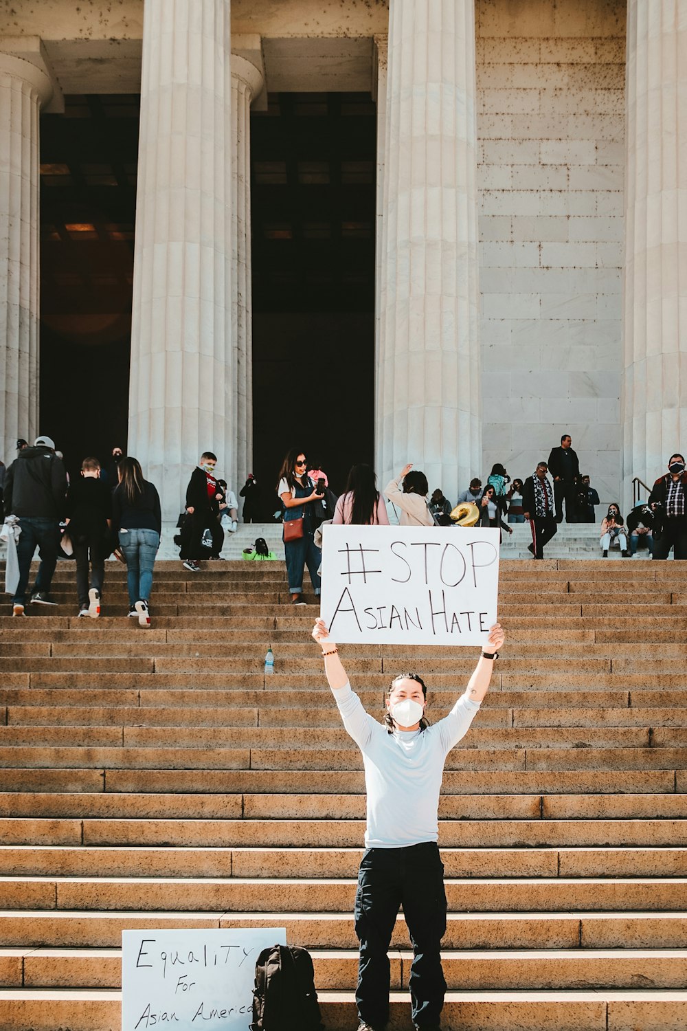 people standing and holding white paper