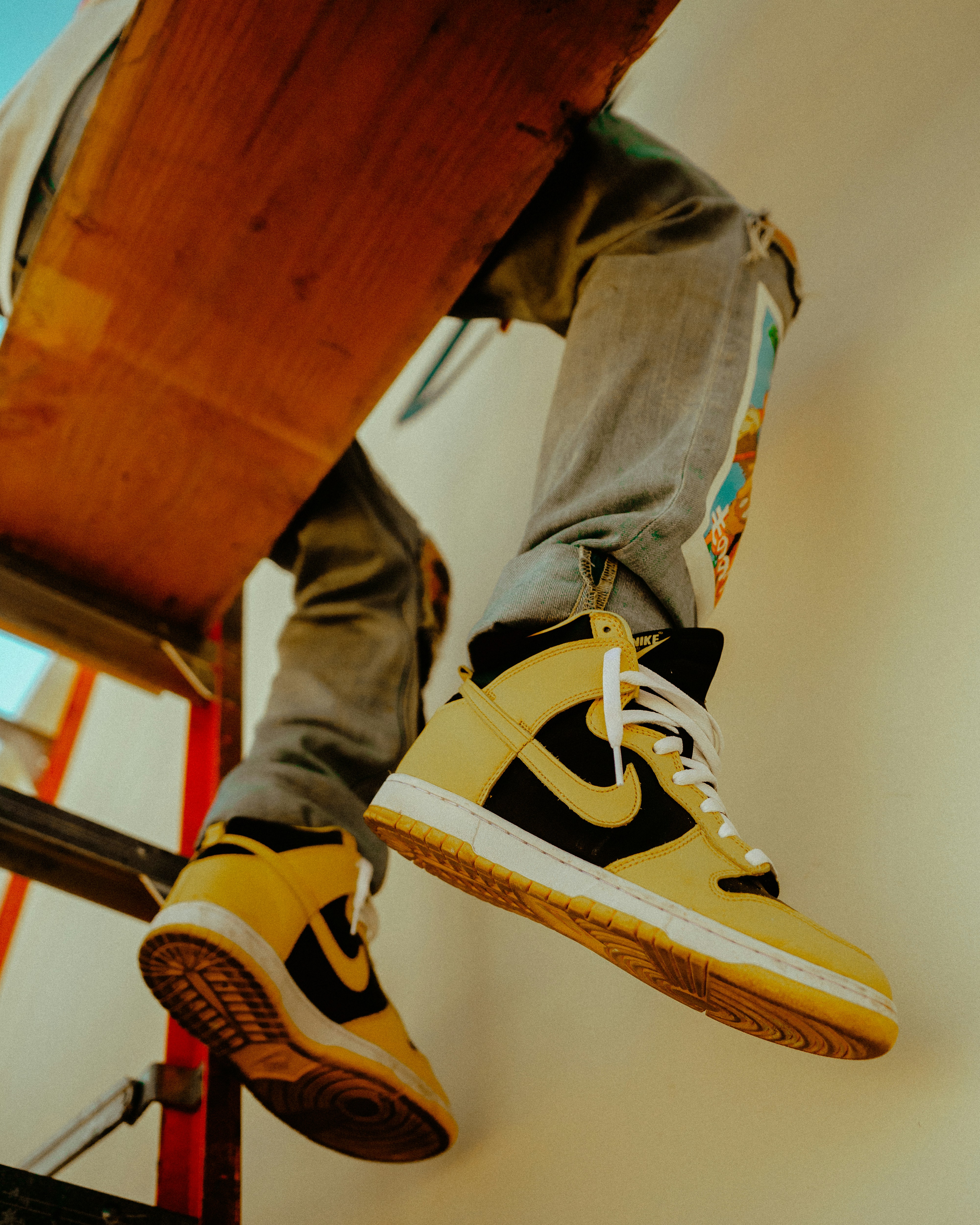 person wearing black and white nike sneakers