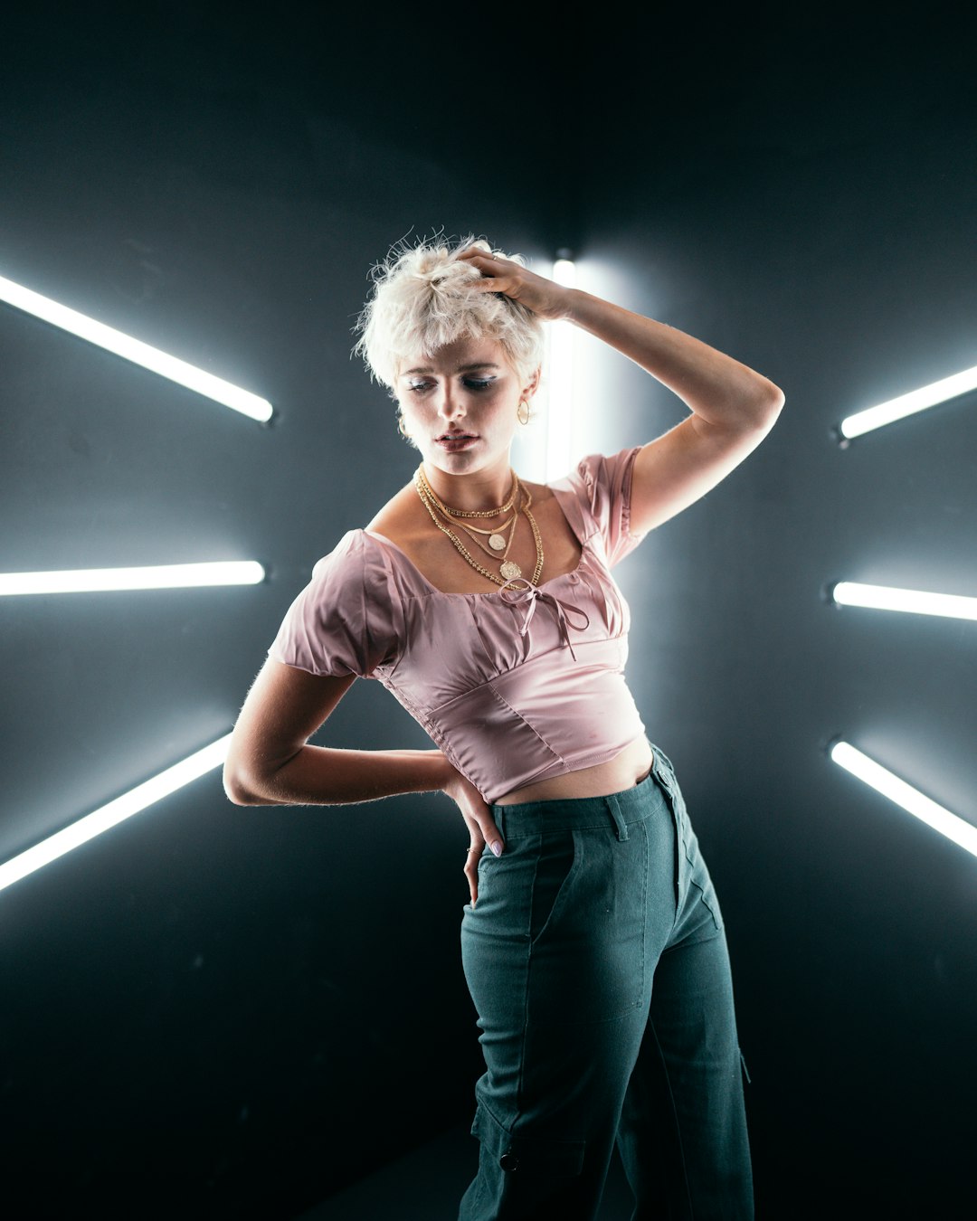 woman in pink tank top and blue denim jeans