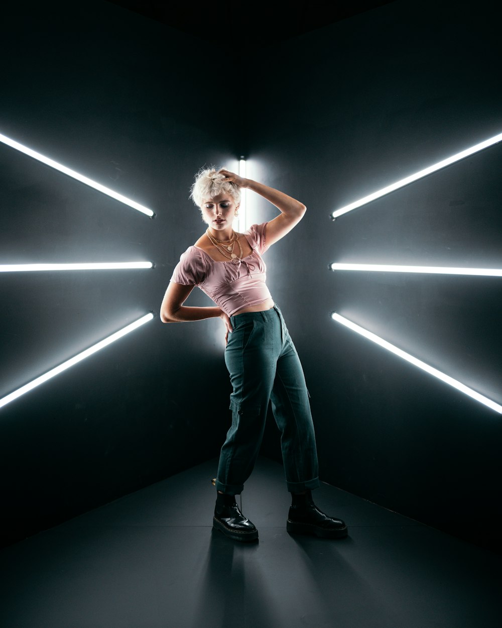 woman in pink tank top and blue denim jeans