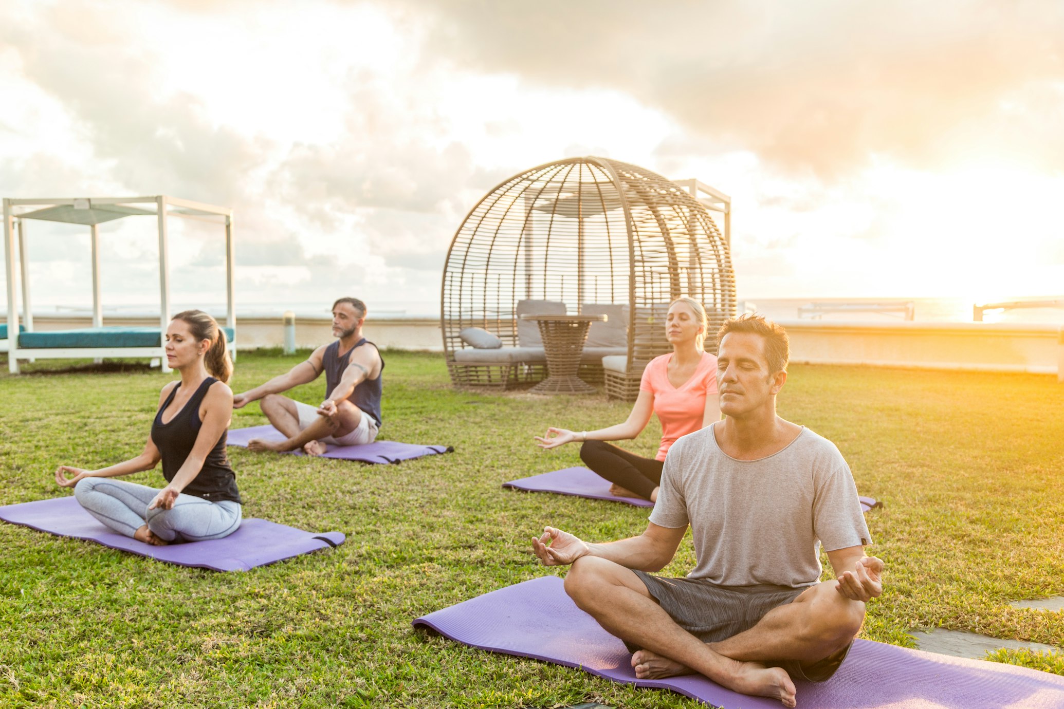 A group of yogis is meditating in a reputable retreat center”