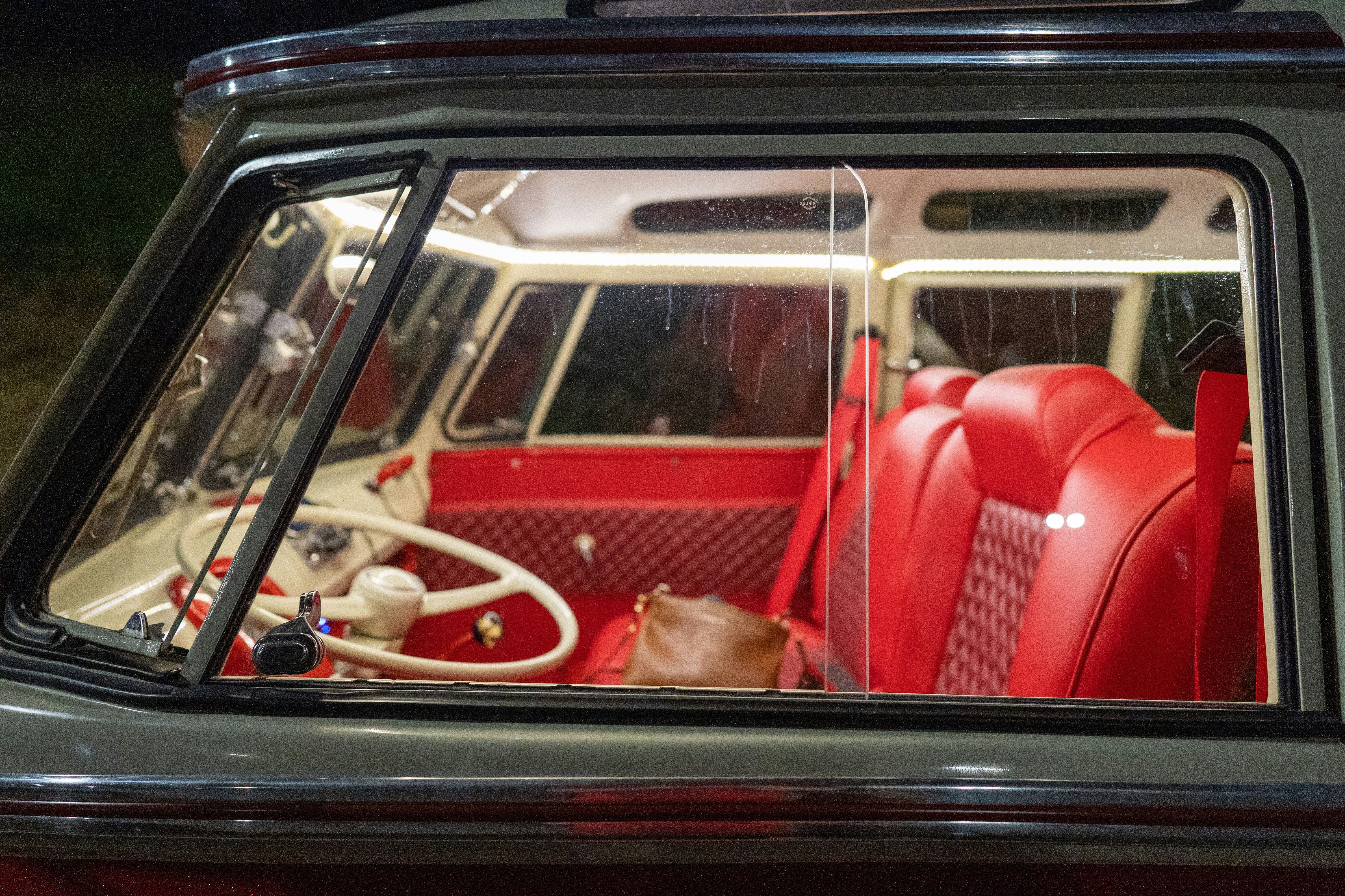 Large luxury electric SUV similar to Volvo EX90 parked near a modern home