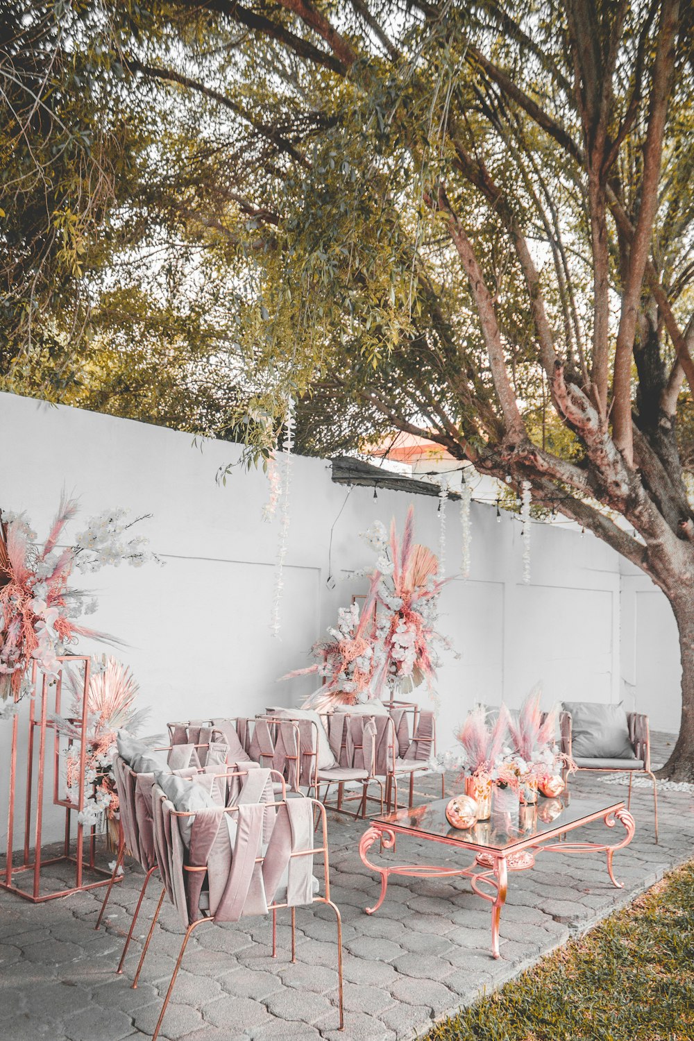 red metal chairs and table near white wall