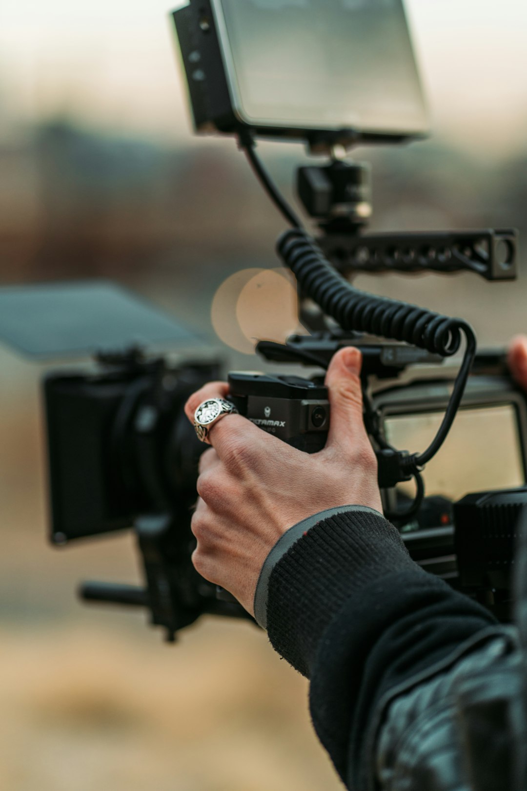 person holding black video camera