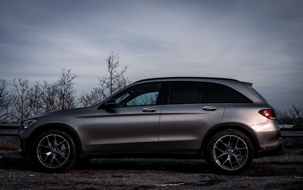 silver suv on black soil