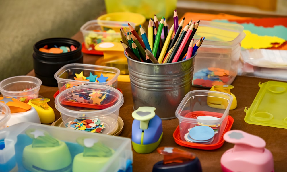 assorted color pencils in clear plastic container