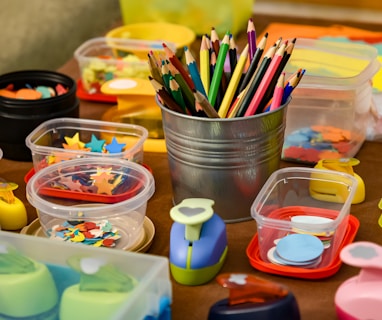 assorted color pencils in clear plastic container