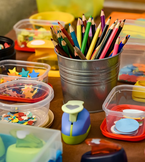 assorted color pencils in clear plastic container