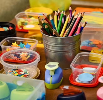 assorted color pencils in clear plastic container