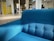 A clean and refreshed living room featuring a bright, spotless sofa.