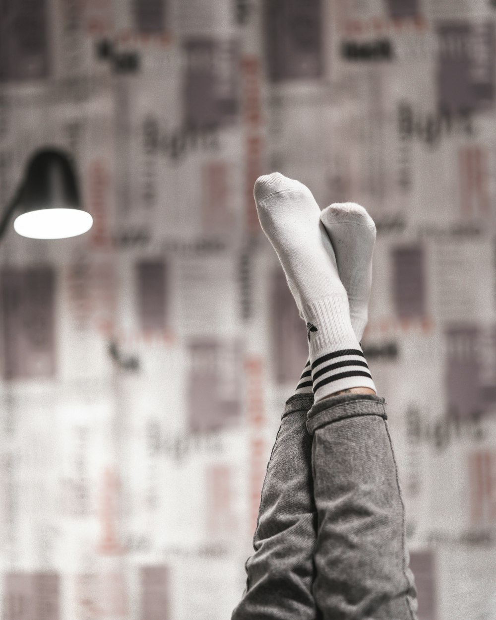 person in black denim jeans and white socks