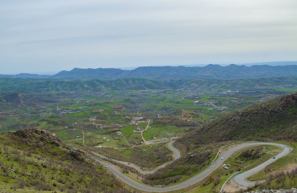 green mountains near body of water during daytime