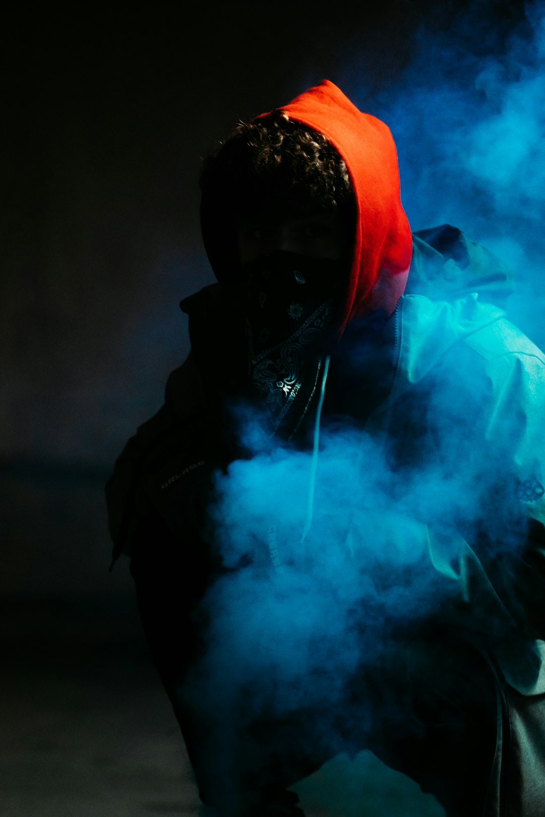 man in black hoodie smoking