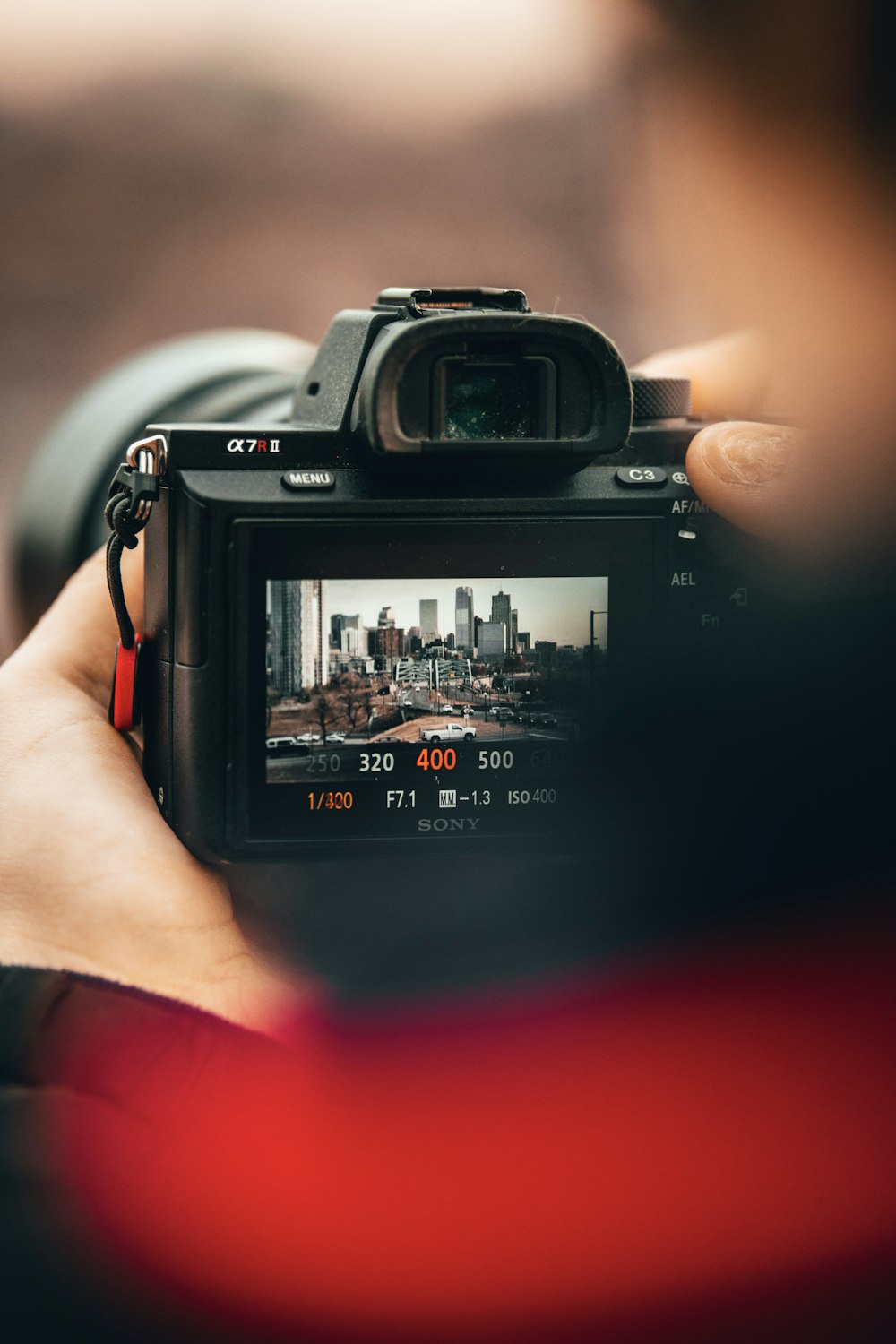 person holding black nikon dslr camera