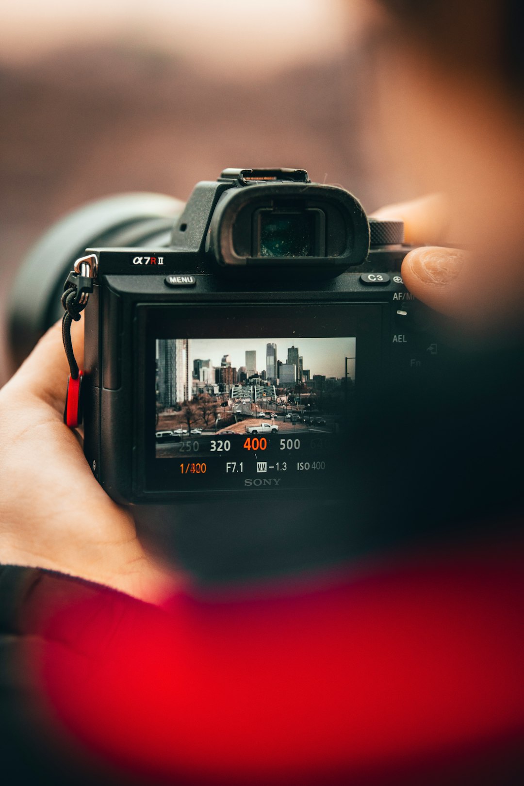 person holding black nikon dslr camera