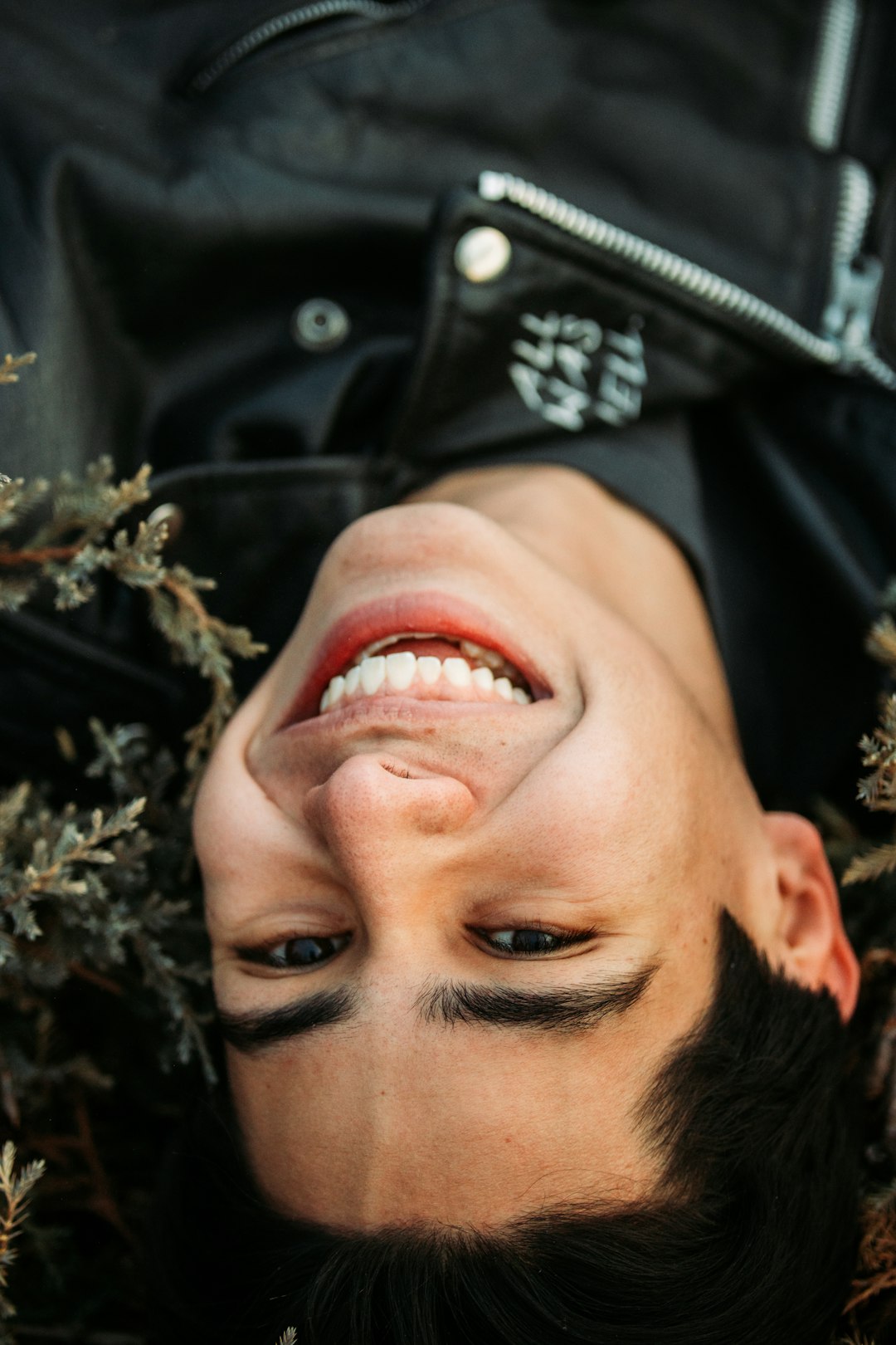 man in black jacket smiling