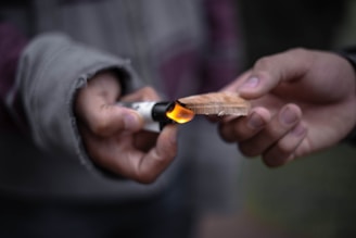 A beginner happily practicing wood-burning with the e-book open nearby.