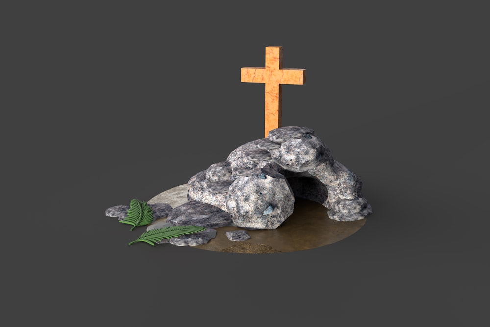 gray stone cross on brown wooden round table