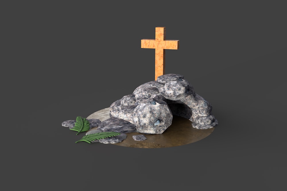 Croix en pierre grise sur table ronde en bois marron