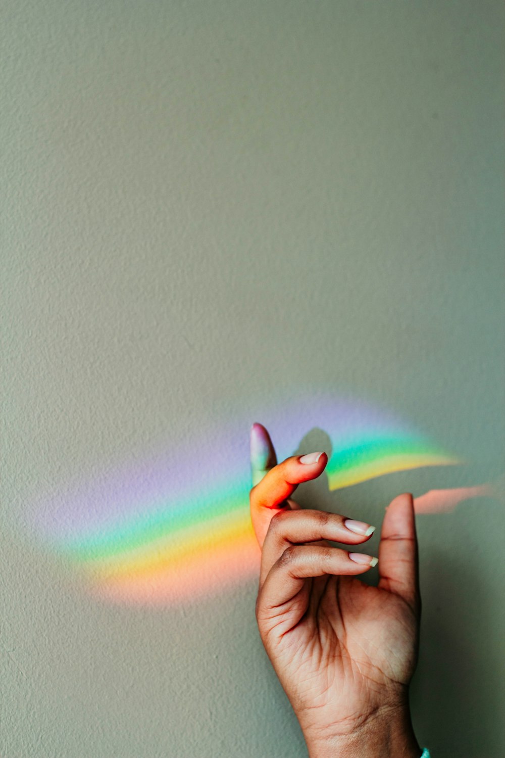 persons hand with purple light