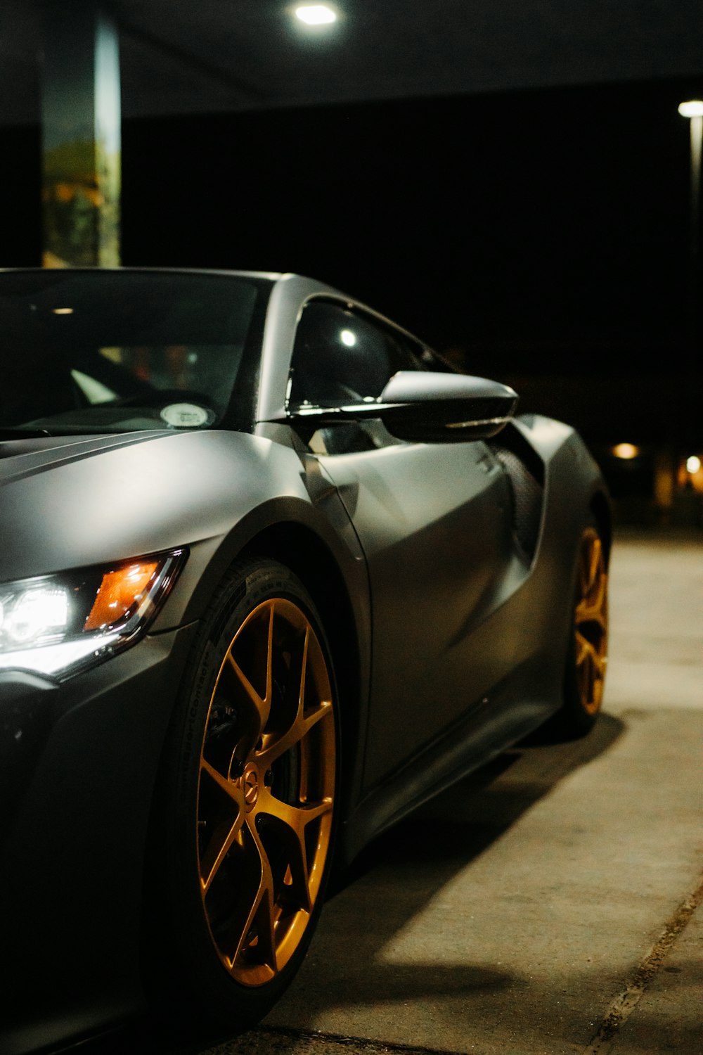 black porsche 911 parked on parking lot