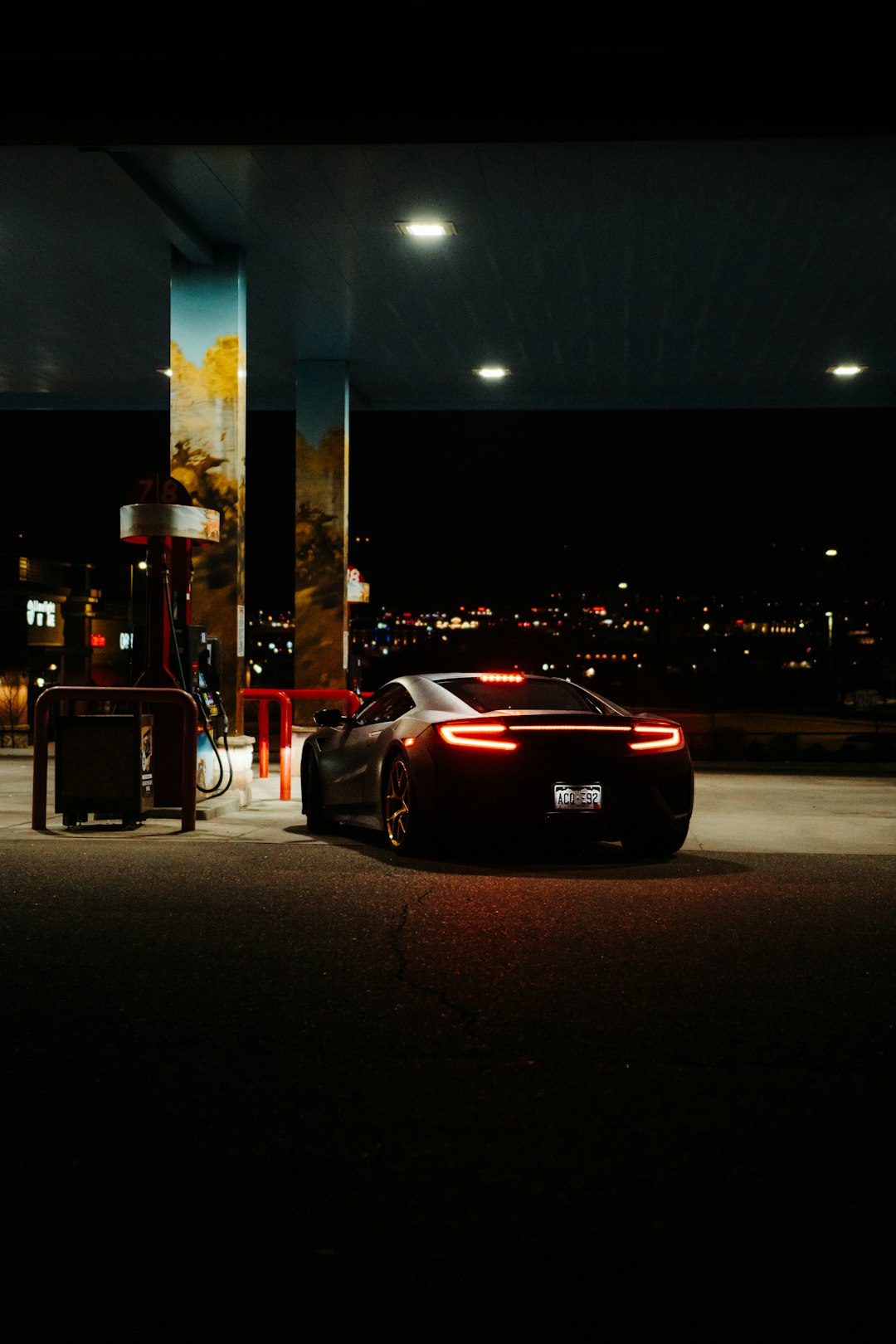 red porsche 911 parked on parking lot during nighttime