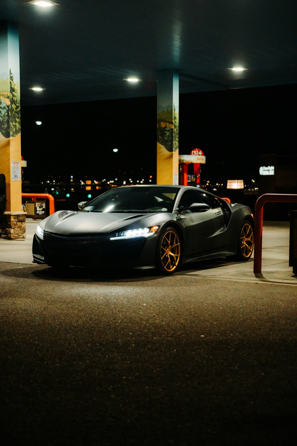 black porsche 911 parked on parking lot during night time