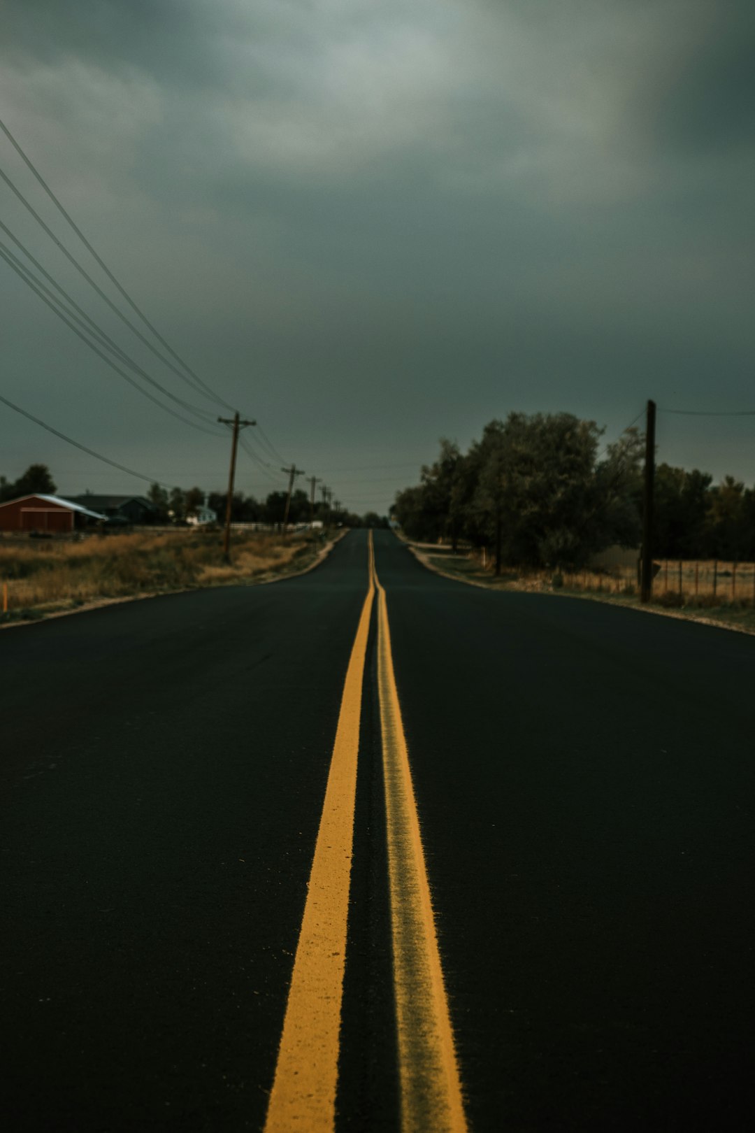 black asphalt road under blue sky during daytime