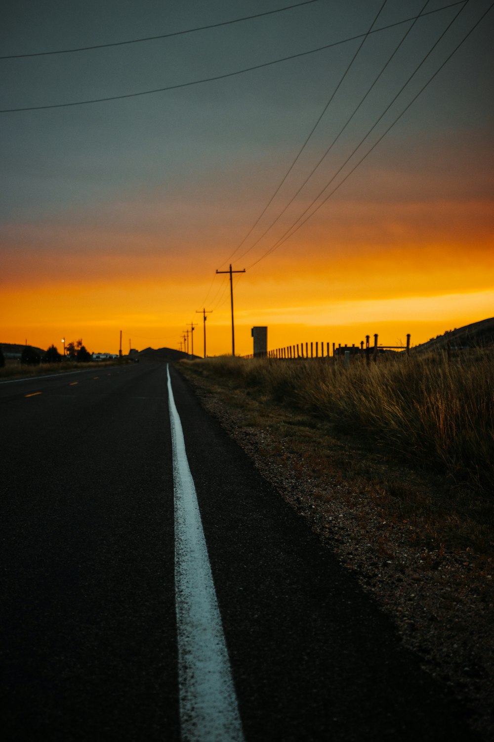 black car on road during sunset