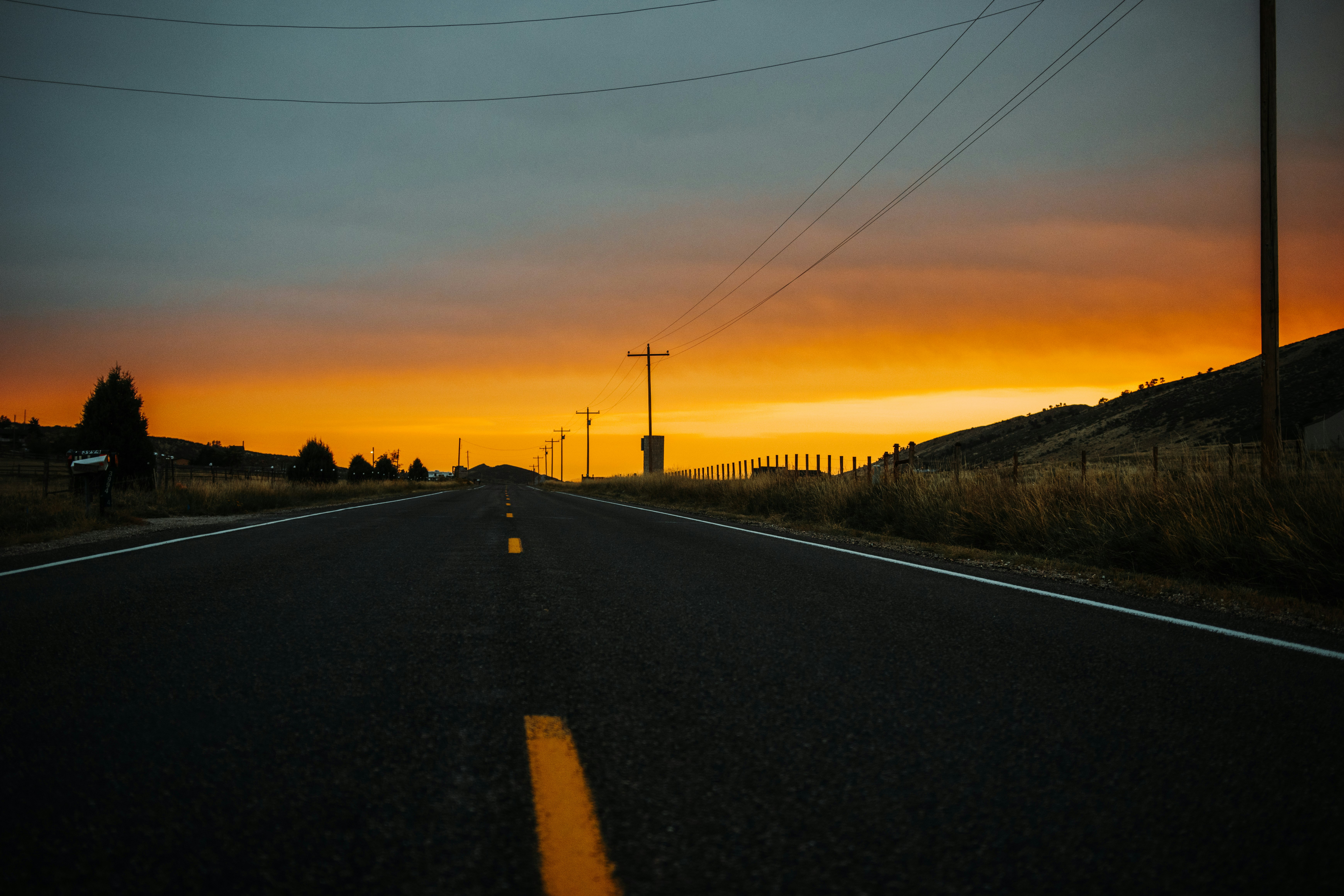 black asphalt road during sunset