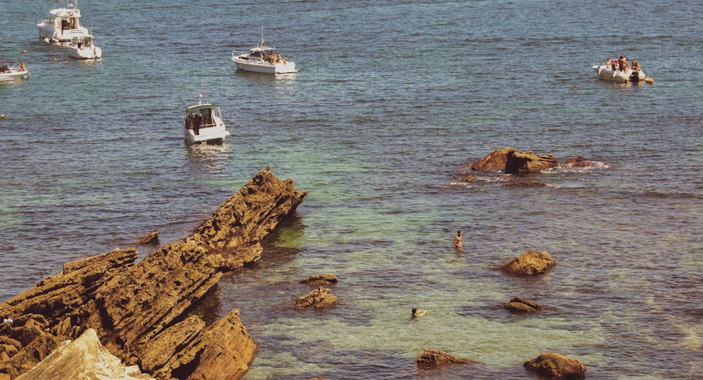 white boat on sea during daytime