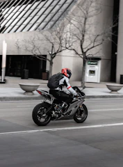 Experienced motorcyclist practicing defensive riding techniques on city streets.