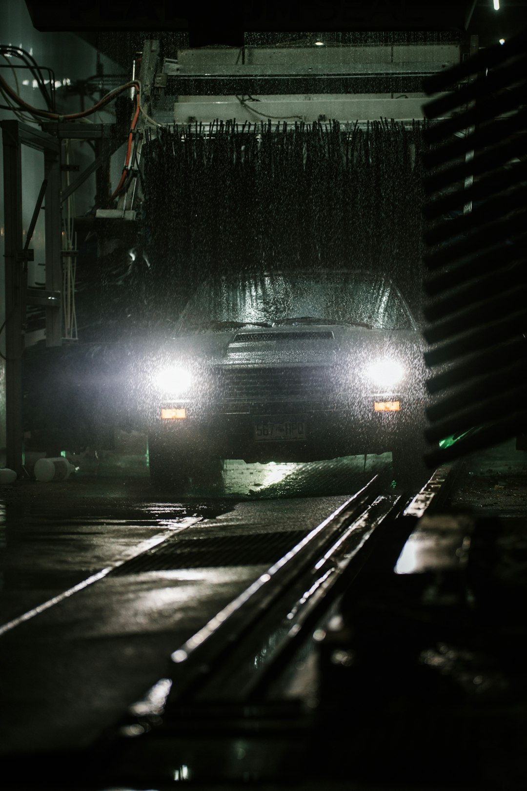 black car on road during night time