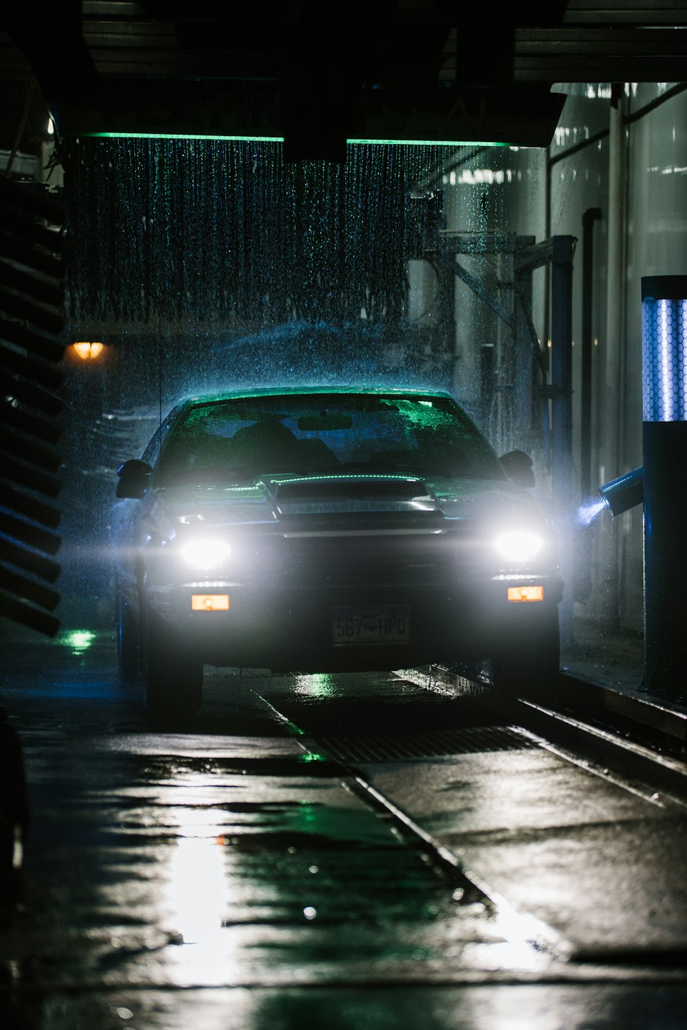 white car on road during night time