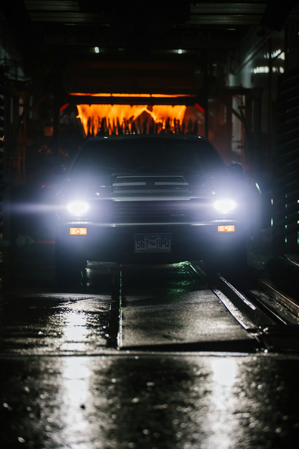 black car on road during night time