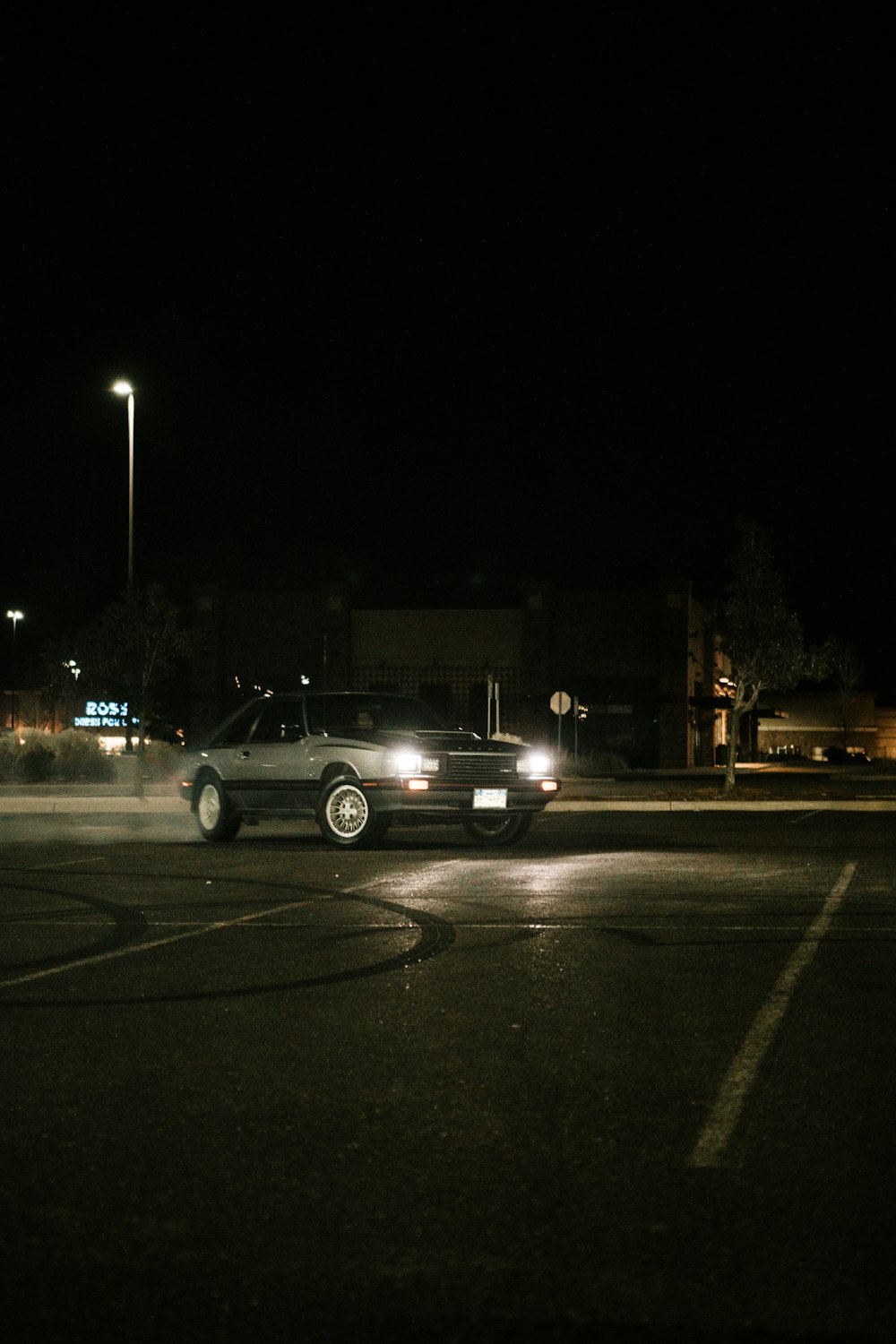 white suv on road during night time