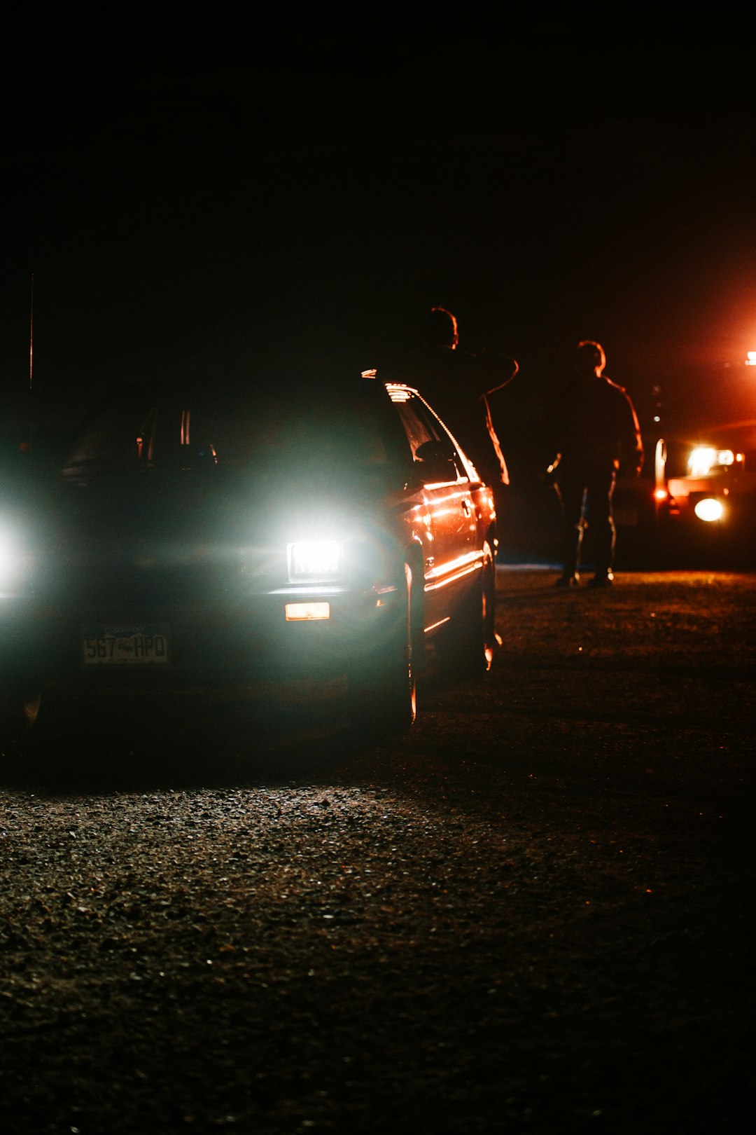 white car on road during night time