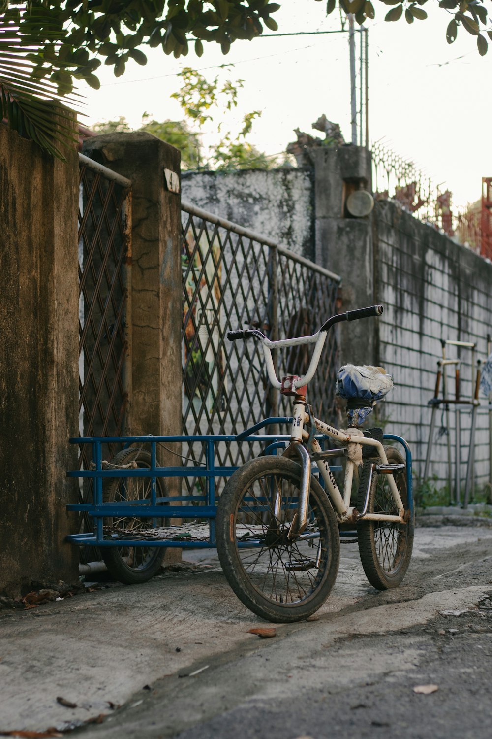 blue and red bicycle with training wheels