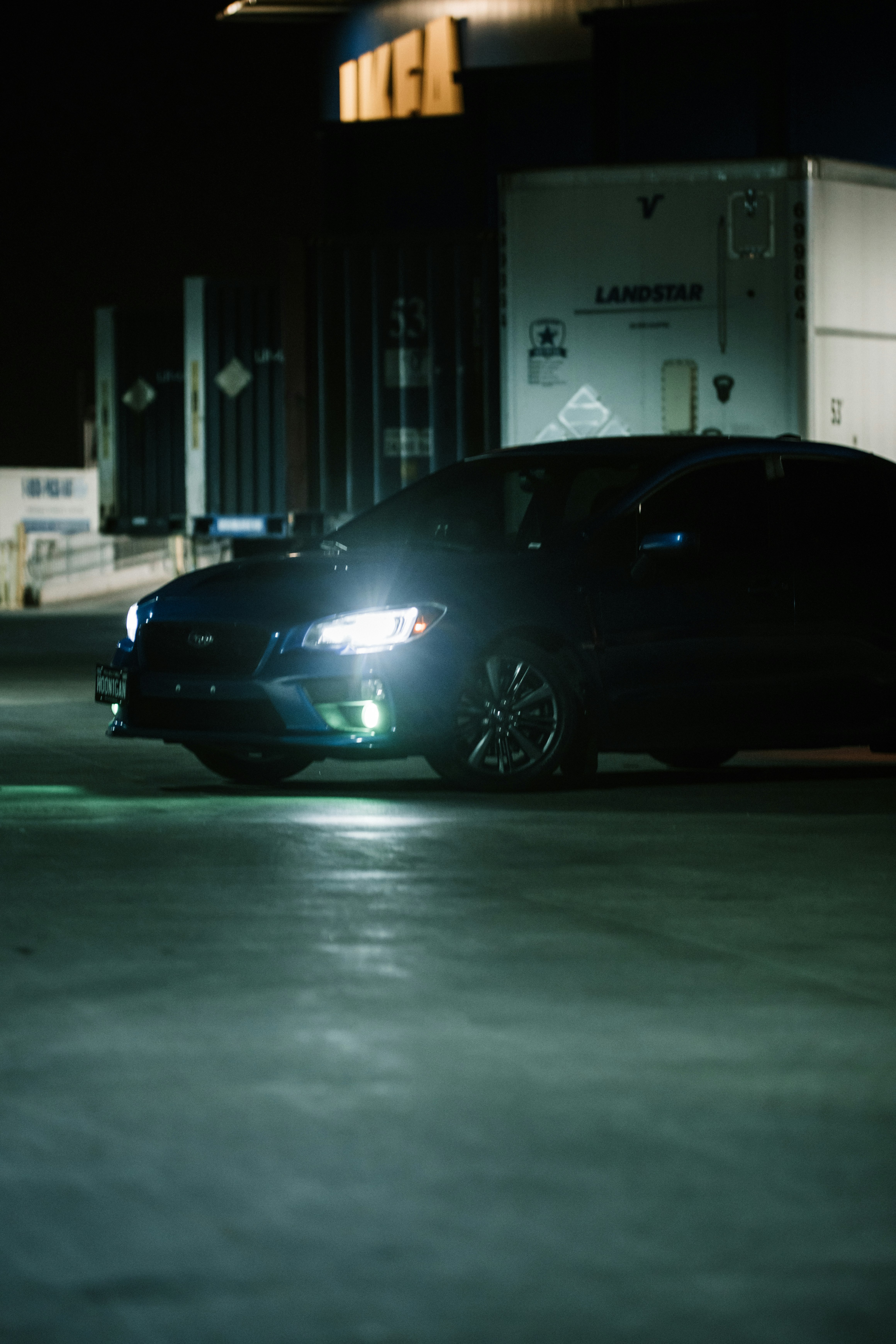 black car in a parking lot