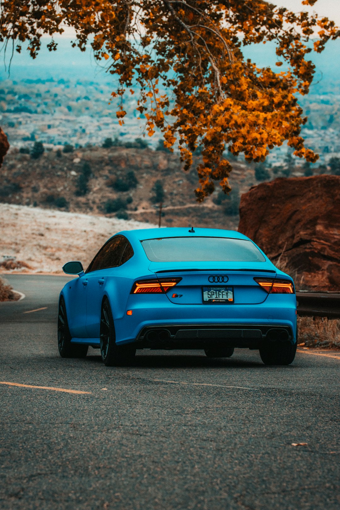 blue chevrolet camaro on road during daytime