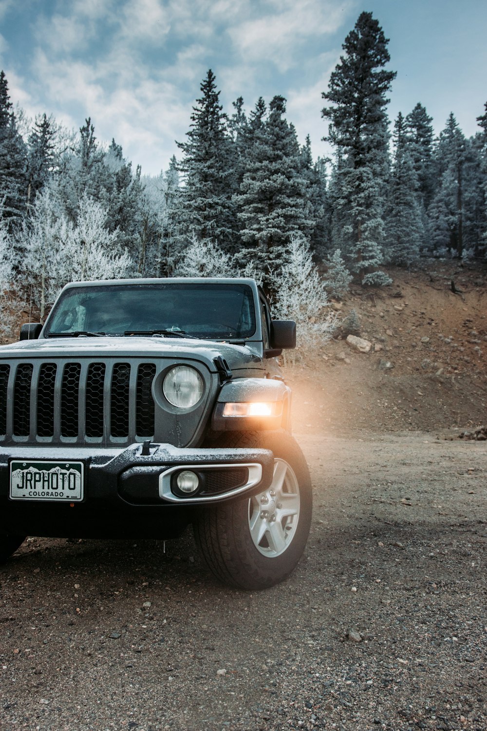 black jeep wrangler on dirt road during daytime