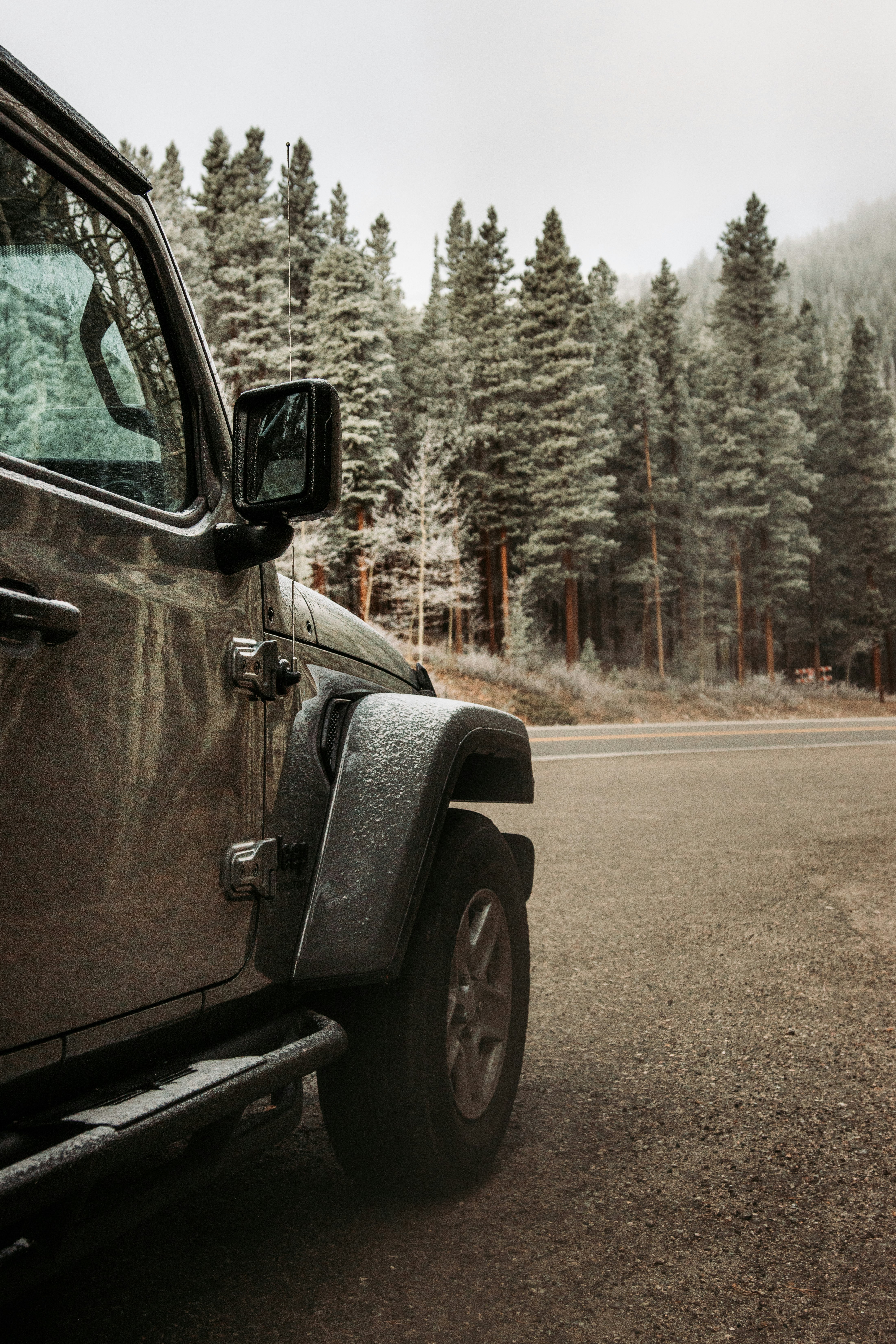 black car on dirt road during daytime