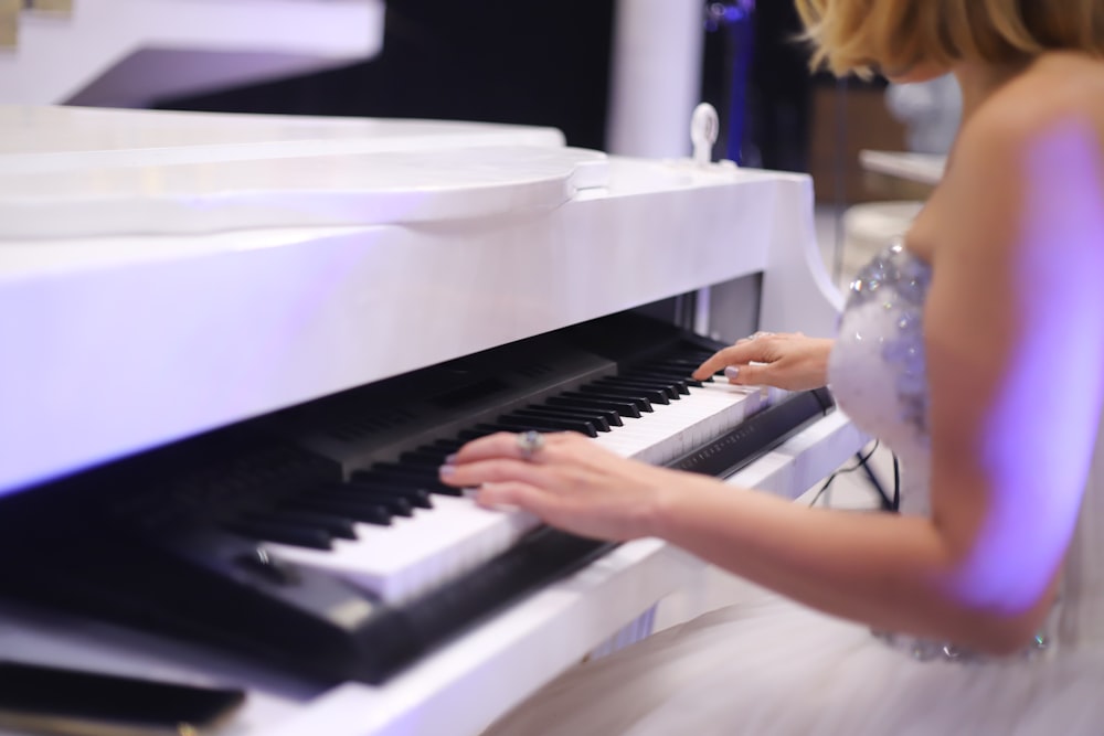 person playing piano in room