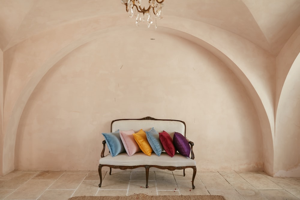 blue and red throw pillows on black armchair