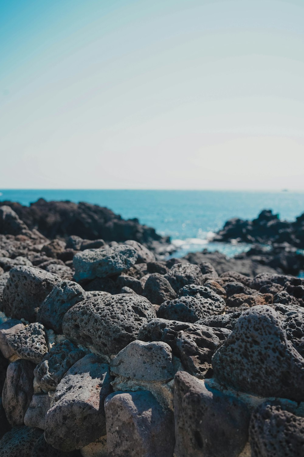 gray and white rocky shore during daytime