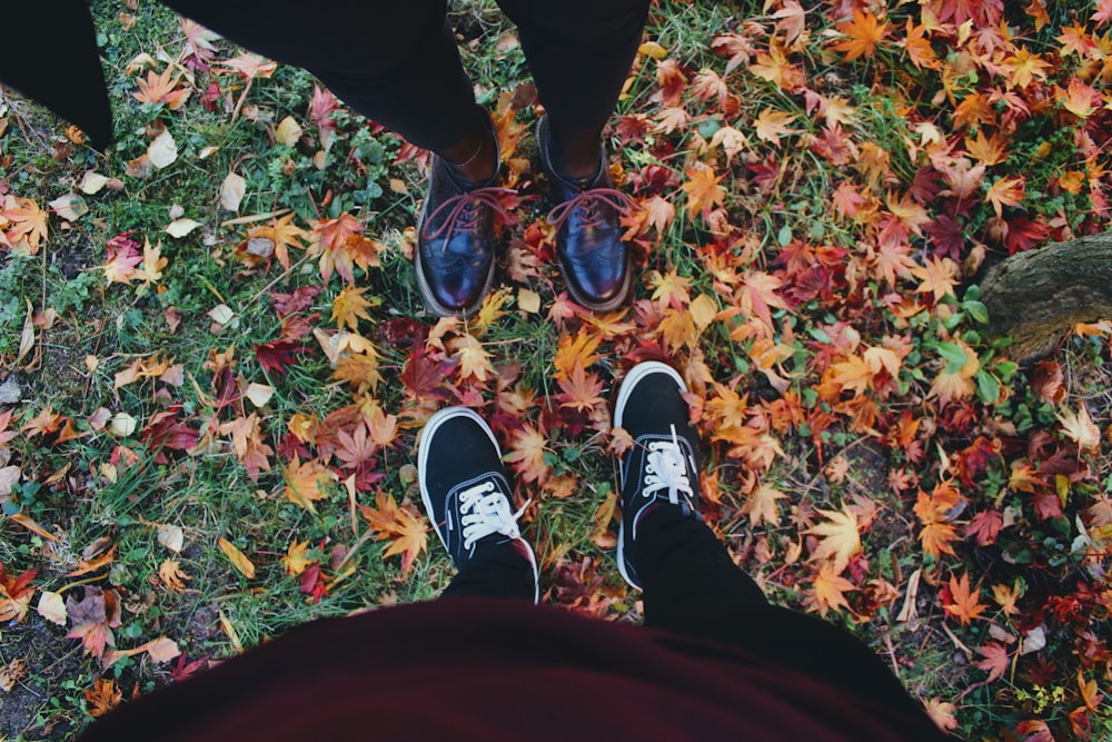 person wearing black and white nike sneakers