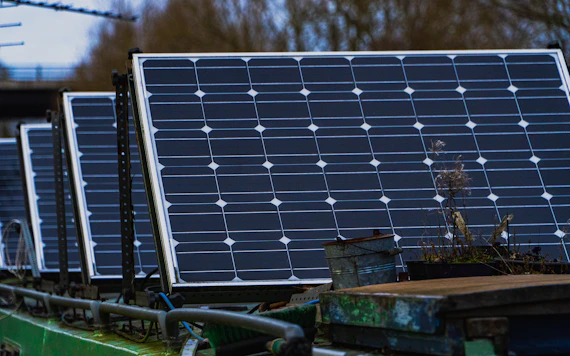 blue solar panels on brown wooden bench